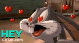 Bugs Bunny Surrounded By Flying Hearts GIF