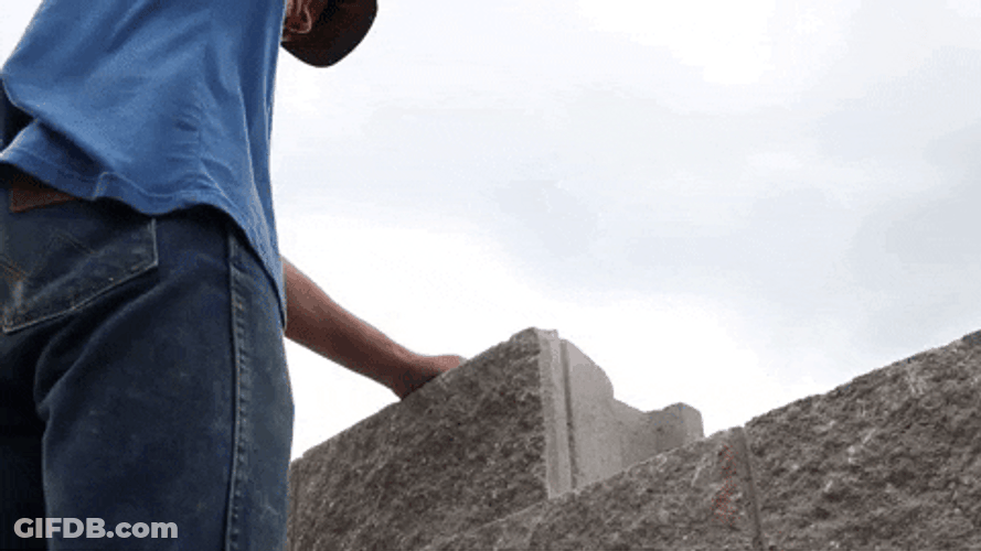 Build The Wall Hammering Brick GIF