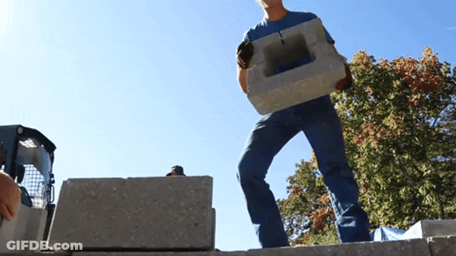 Build The Wall Lifting Concrete Blocks GIF