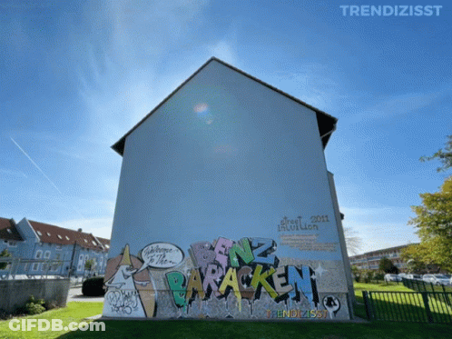 Building With Graffiti That Says Trendzisst GIF