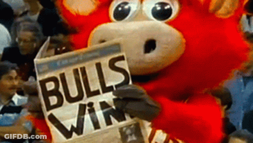 Bull Mascot Holding Bulls Win Newspaper GIF