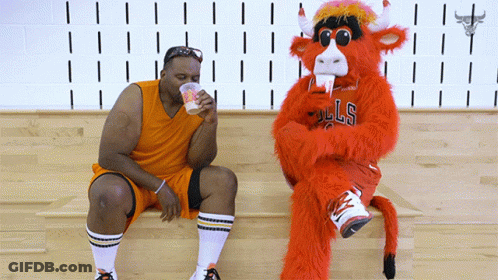 Bulls Mascot Next To Basketball Player GIF