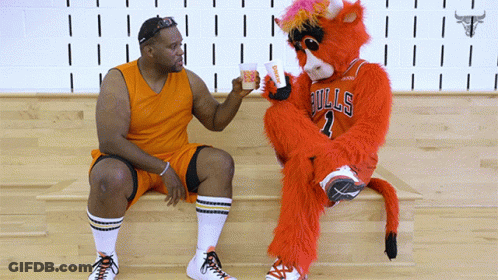 Bulls Mascot Sitting On Bench With Basketball Player GIF