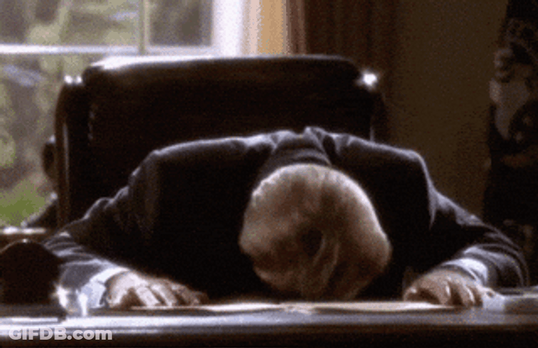 Bumping Head Onto Desk GIF
