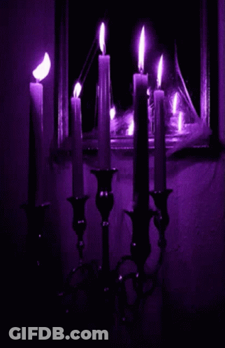 Bunch Of Lit Candles In Dark Room GIF