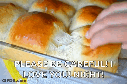 Bunch Of Rolls In Pan With Love Message GIF