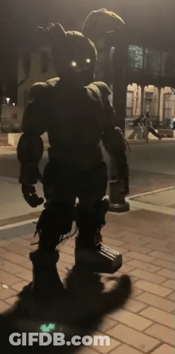 Bunny Statue With Glowing Eyes On Brick Sidewalk GIF