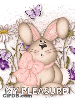 Bunny With Pink Bow Sitting In Flowers GIF