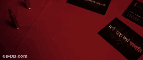 Business Cards On Red Surface With Diamond In Circle GIF
