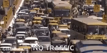 Busy City Street With Cars And Buses Saying No Traffic GIF