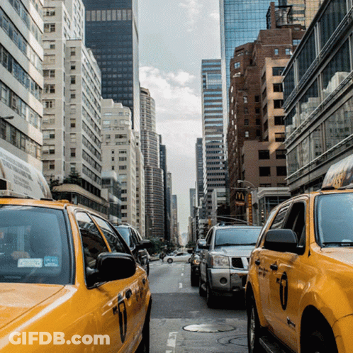 Busy City Street With McDonald's Sign GIF