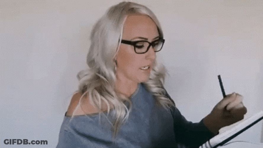 Busy Woman Taking Notes GIF