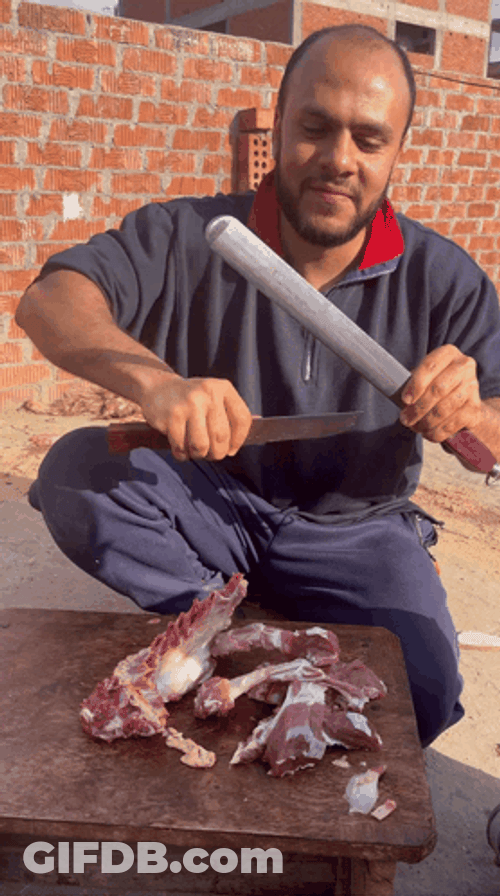 Butcher Sharpens Knife GIF