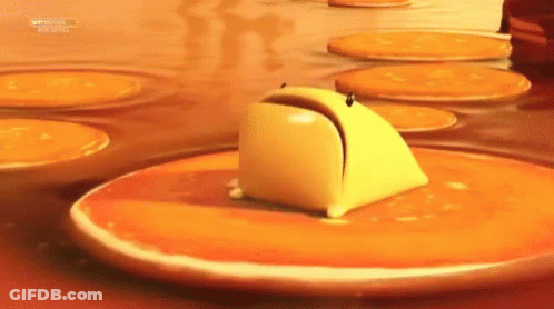 Butter Stirred In Frying Pan With Red Spatula GIF