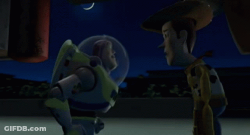 Buzz Lightyear And Woody Are Standing Next To Each Other At Night GIF