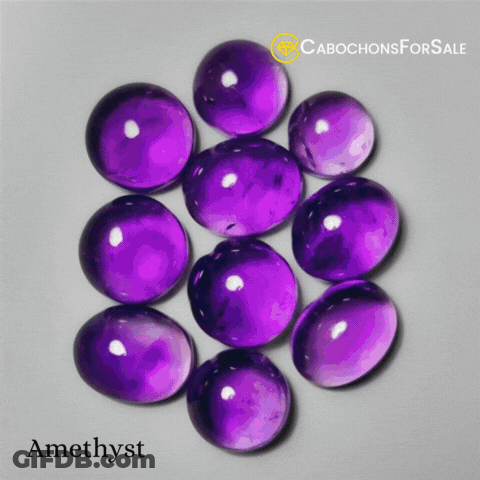 Cabochons For Sale Amethyst Is Displayed On A Grey Background GIF