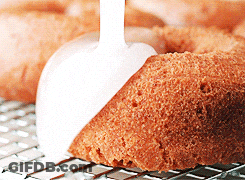 Cake On Cooling Rack With Spoon GIF