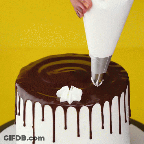 Cake With Chocolate Icing And Whipped Cream GIF