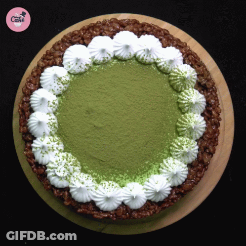 Cake With Whipped Cream And Green Powder GIF