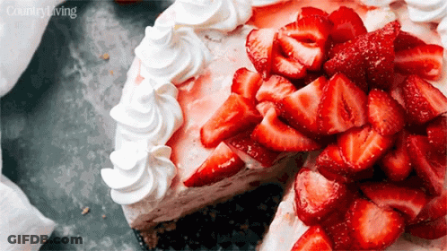 Cake With Whipped Cream And Strawberries With Piece Taken Out GIF
