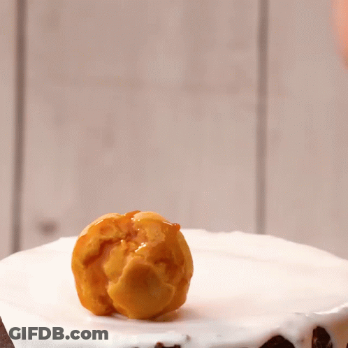 Cake With White Frosting And Caramel Pieces GIF