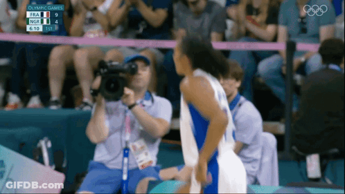 Cameraman Taking Picture Of Basketball Game At Olympics GIF