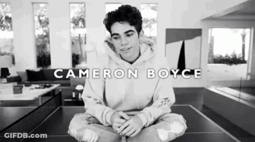 Cameron Boyce Sitting On Ping Pong Table GIF