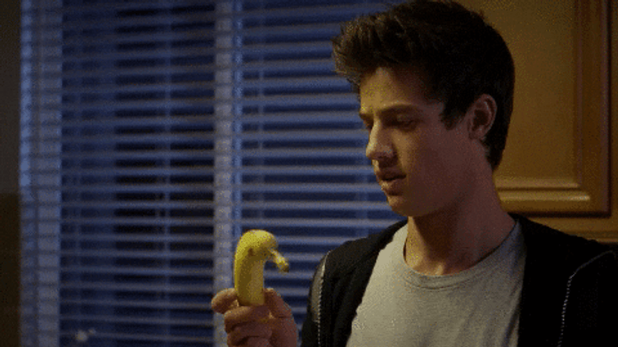 Cameron Dallas Holding And Spinning Banana GIF