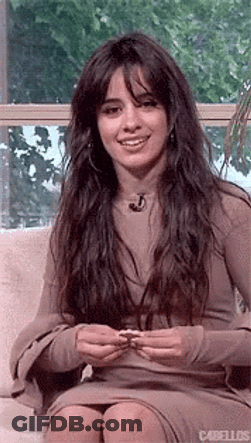 Camila Cabello Holding Famous Amos Cookie GIF
