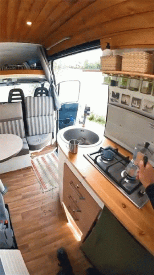 Camper Pouring Water On Sink GIF