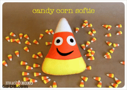 Candy Corn Softie Surrounded By Candy Corn GIF