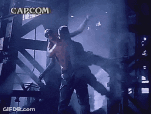 Capcom Ad Two Men Fighting Dark Room GIF