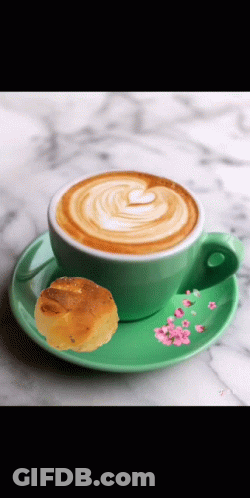 Cappuccino On Green Saucer Next To Cookie GIF