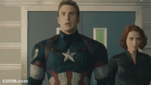 Captain America And Black Widow Are Standing Next To Each Other In A Hallway GIF