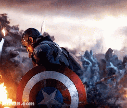 Captain America Is Holding A Shield In Front Of A Group Of Soldiers . GIF