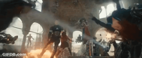 Captain America Is Surrounded By A Group Of Soldiers In A Battle Scene GIF