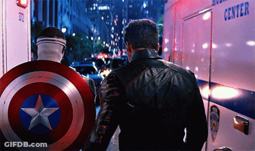 Captain America Shield Man Beside Leather Jacket Man GIF