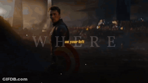 Captain America Stands In Front Of A Crowd With The Words " Where On Your Left " Above Him GIF