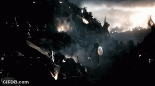 Captain America Walking Through Destroyed City With Shield GIF