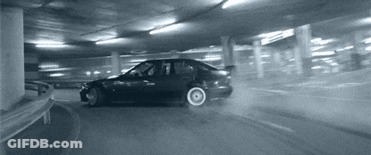 Car Drifting In Parking Garage With Number 7 GIF