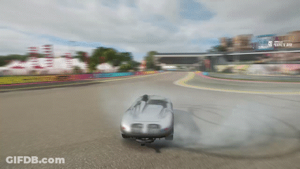 Car Drifting On Race Track With Ferrari Billboard GIF