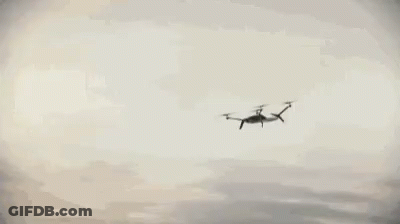 Car Driving Along Curvy Ocean Road GIF