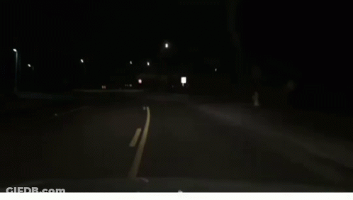 Car Driving At Night Headlights On GIF