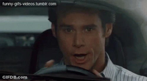 Car Driving Down City Street GIF