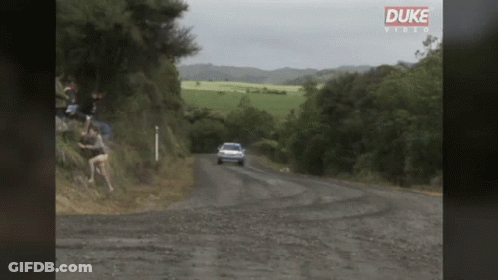 Car Driving Down Dirt Road GIF