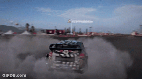 Car Driving Down Dirt Road Race Of The Year Sign GIF