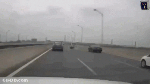 Car Driving Down Highway With Y Sign GIF