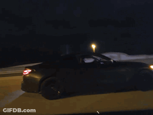 Car Driving Down Road At Night GIF