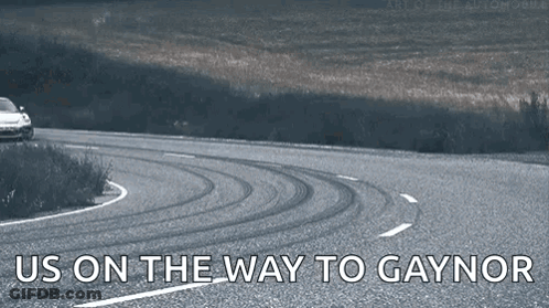 Car Driving Down Road Saying Us On The Way To Gaynor GIF