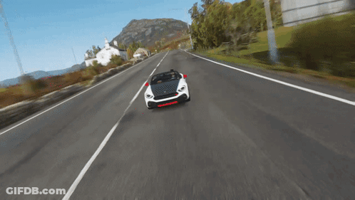 Car Driving Down Road With Mountain GIF